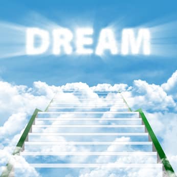 Dream your reality Staircase rising into clouds beneath the word Dream