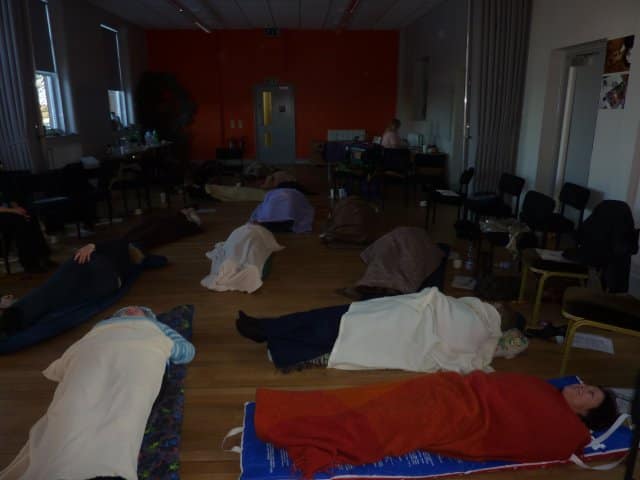 Guided by Angels workshop Workshop participants lying under blankets during a guided relaxation